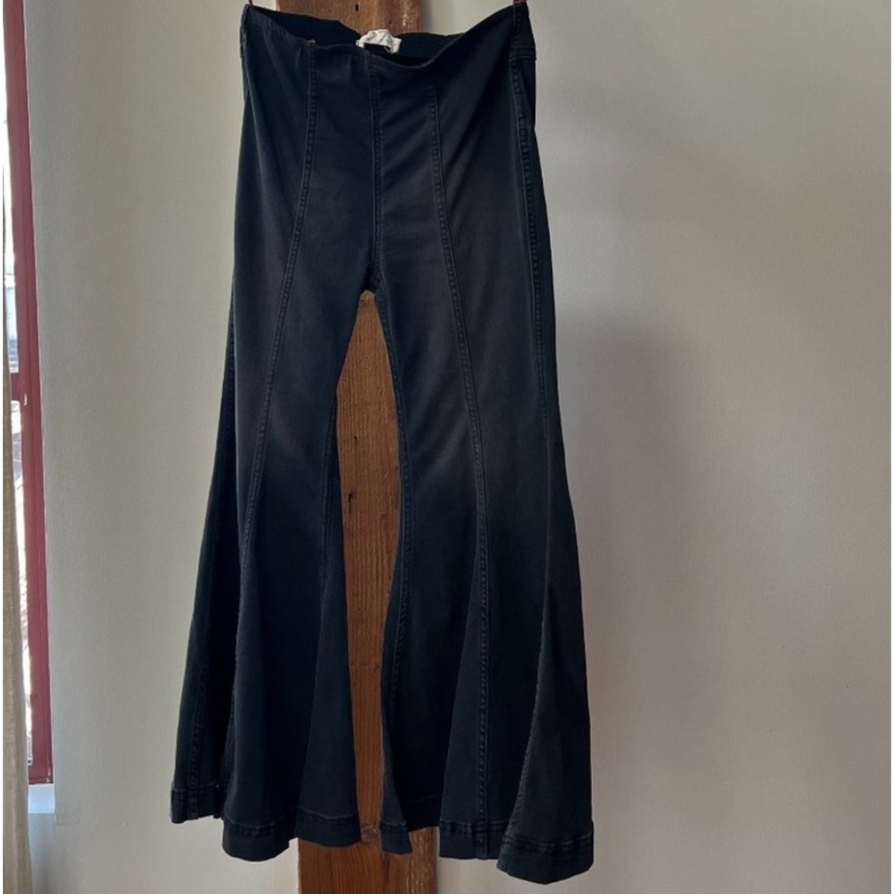 Free people pull on black flares. Size 4 short. Word once